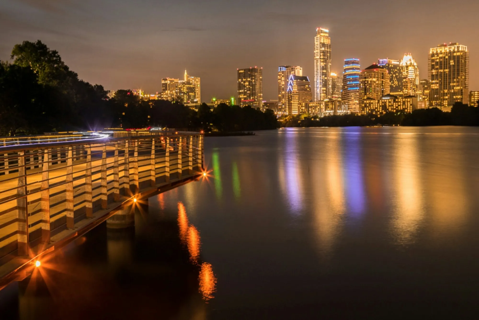 Downtown Austin skyline above Lady Bird Lake at dusk