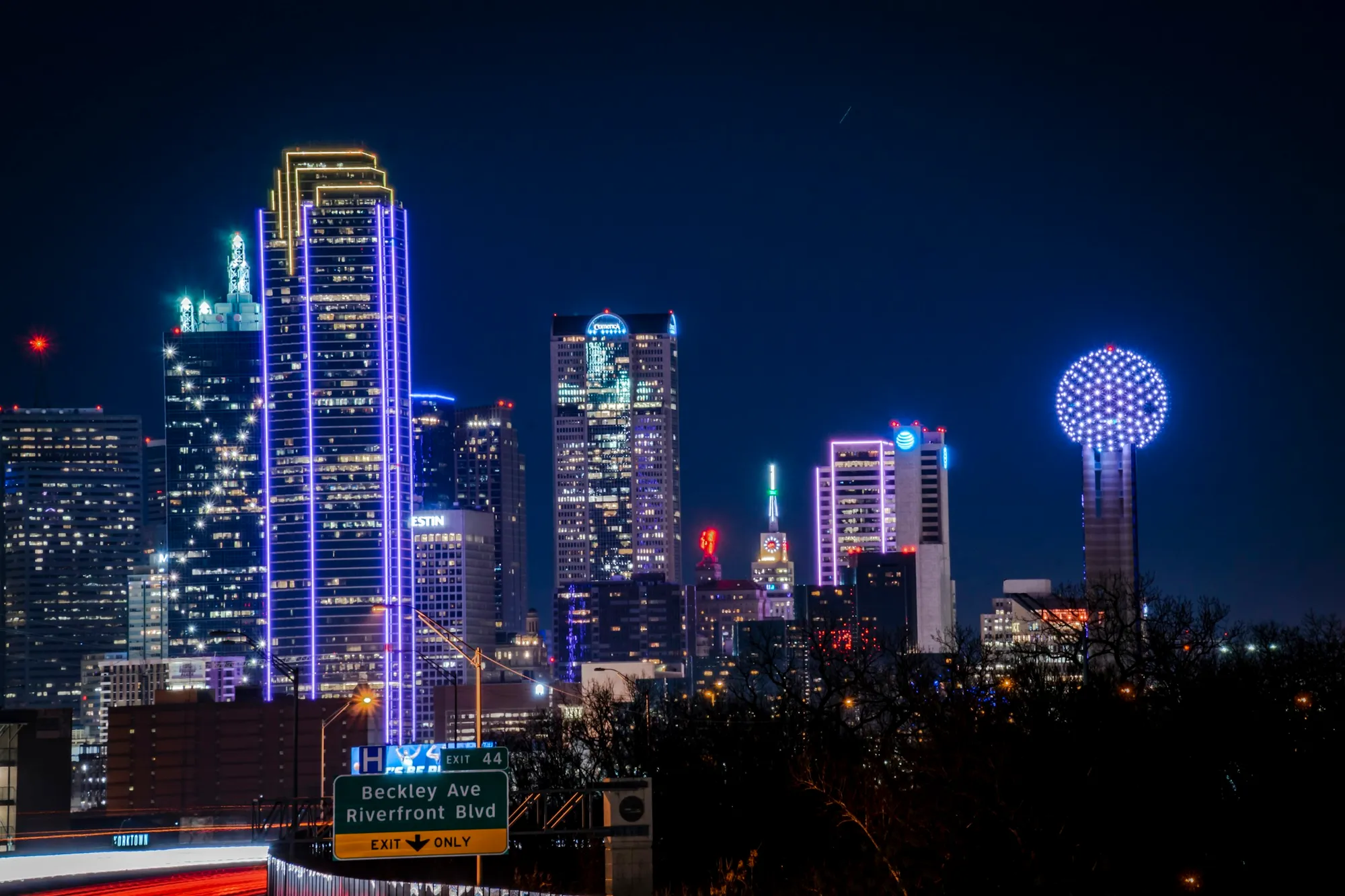 Downtown Dallas skyline lit up at dusk