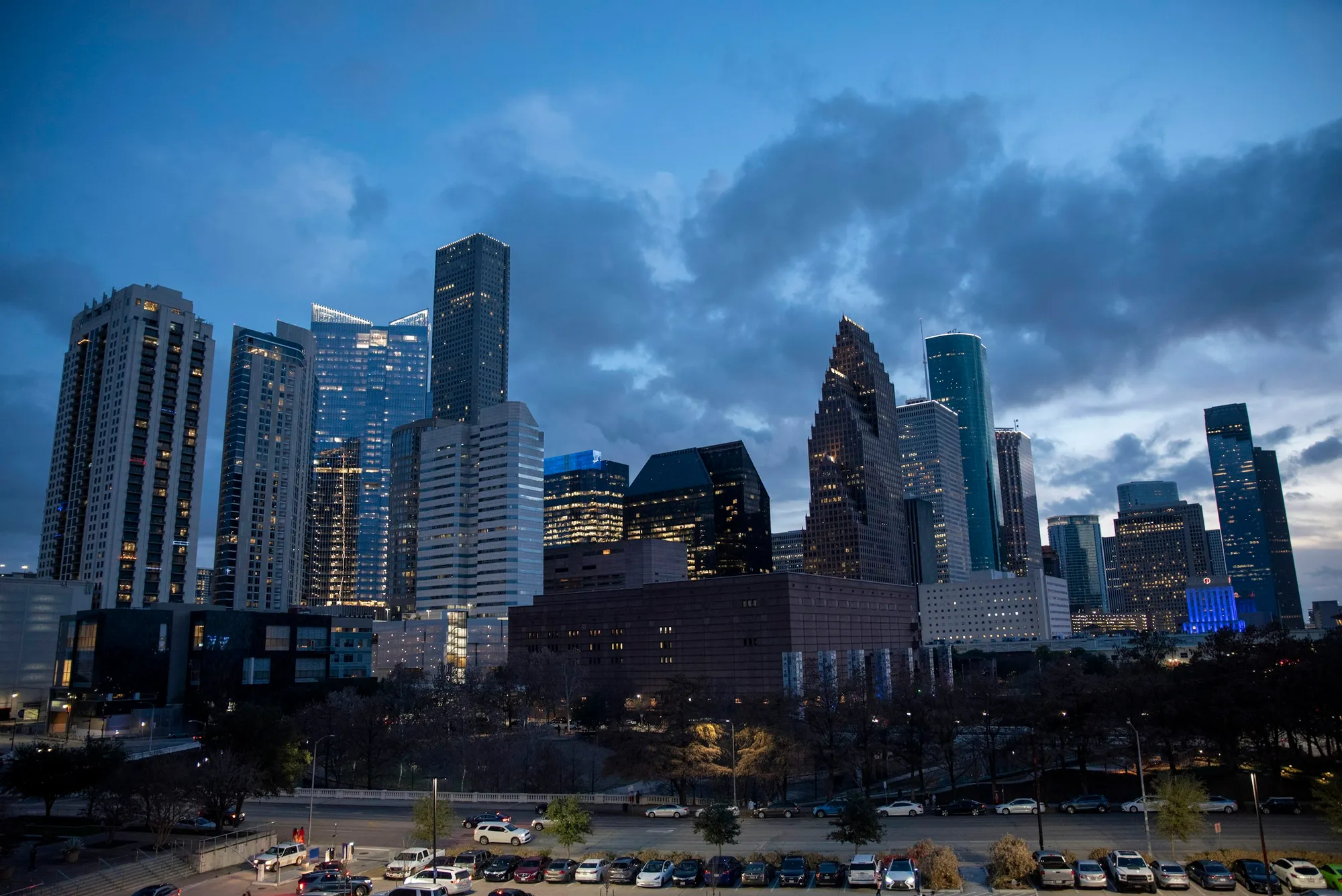 Downtown Houston skyline with high-rise towers under a clear sky